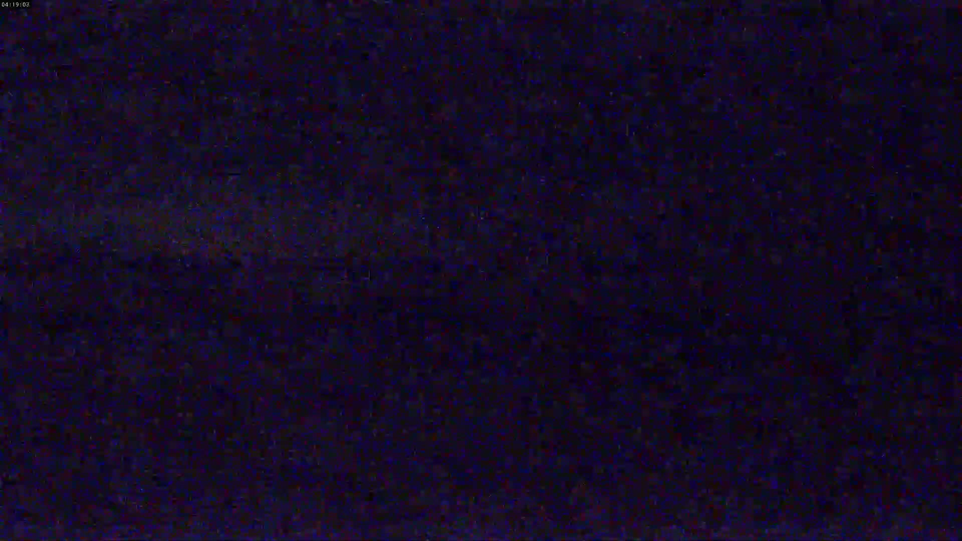 The image shows a dark, grainy, and indistinct scene at night.