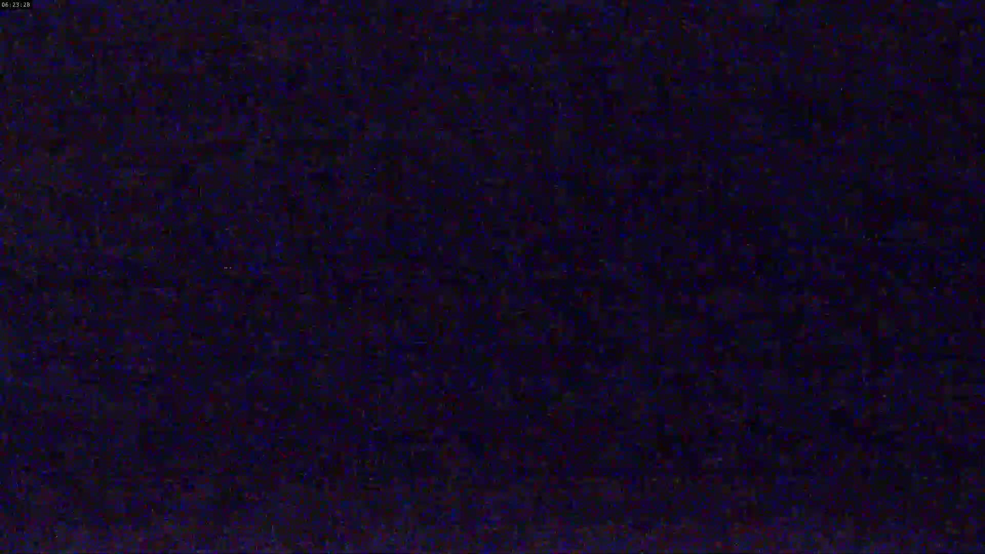 The image shows a dark, mostly uniform blue-black field with subtle variations in shade and texture.