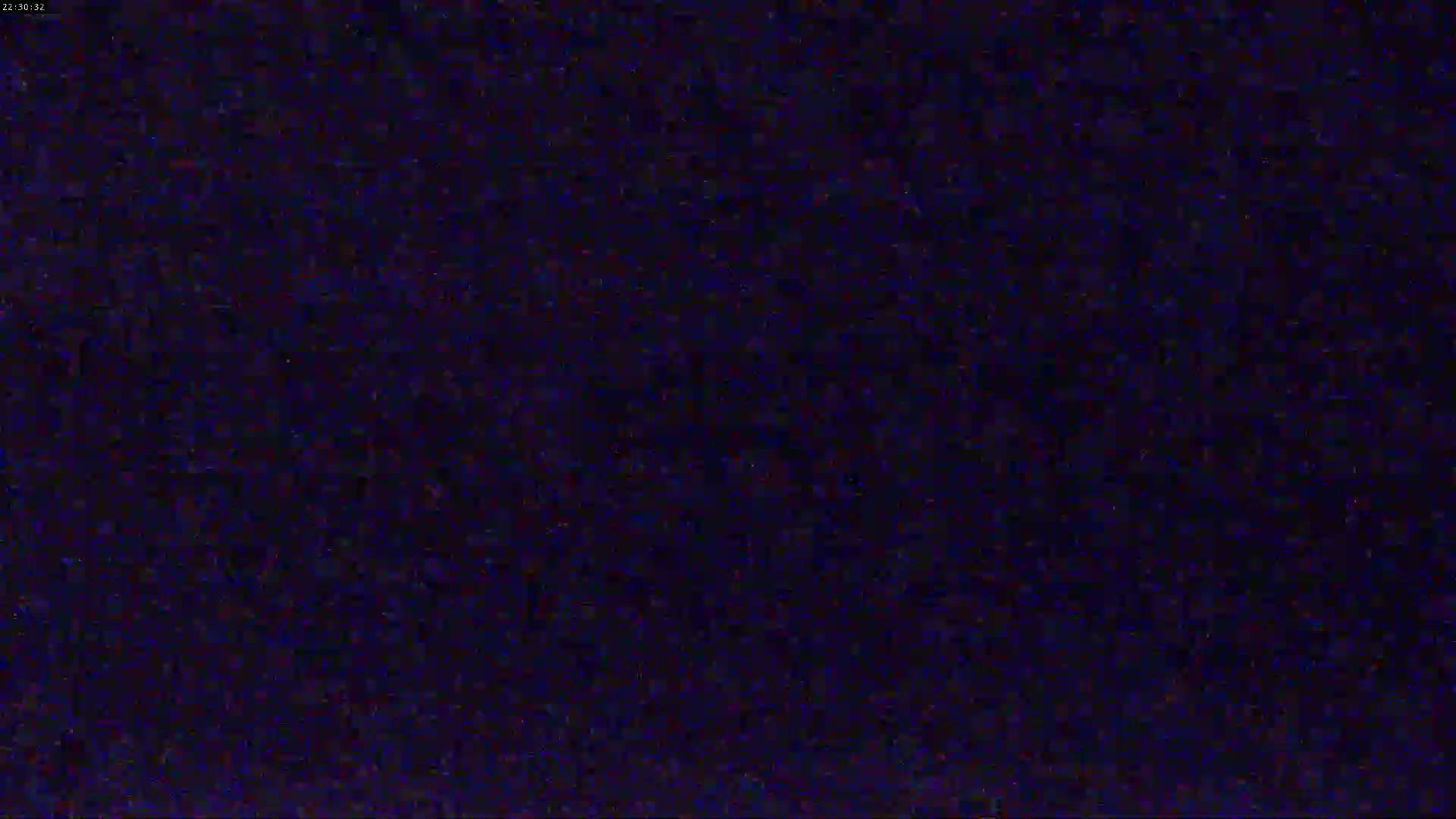 The image shows a dark blue screen filled with static.