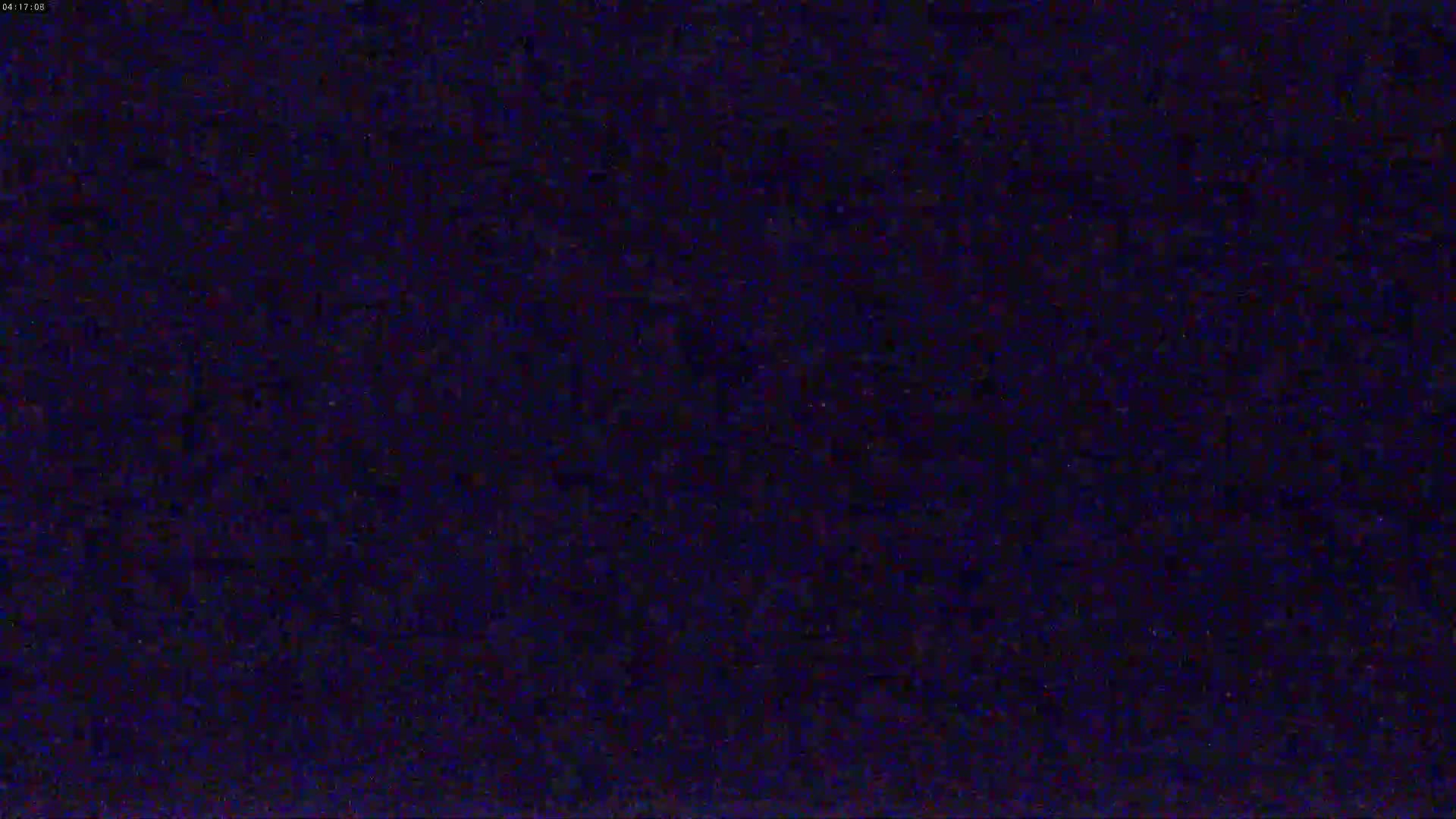 The image shows a dark, mostly uniform blue screen with slight variations in shading.