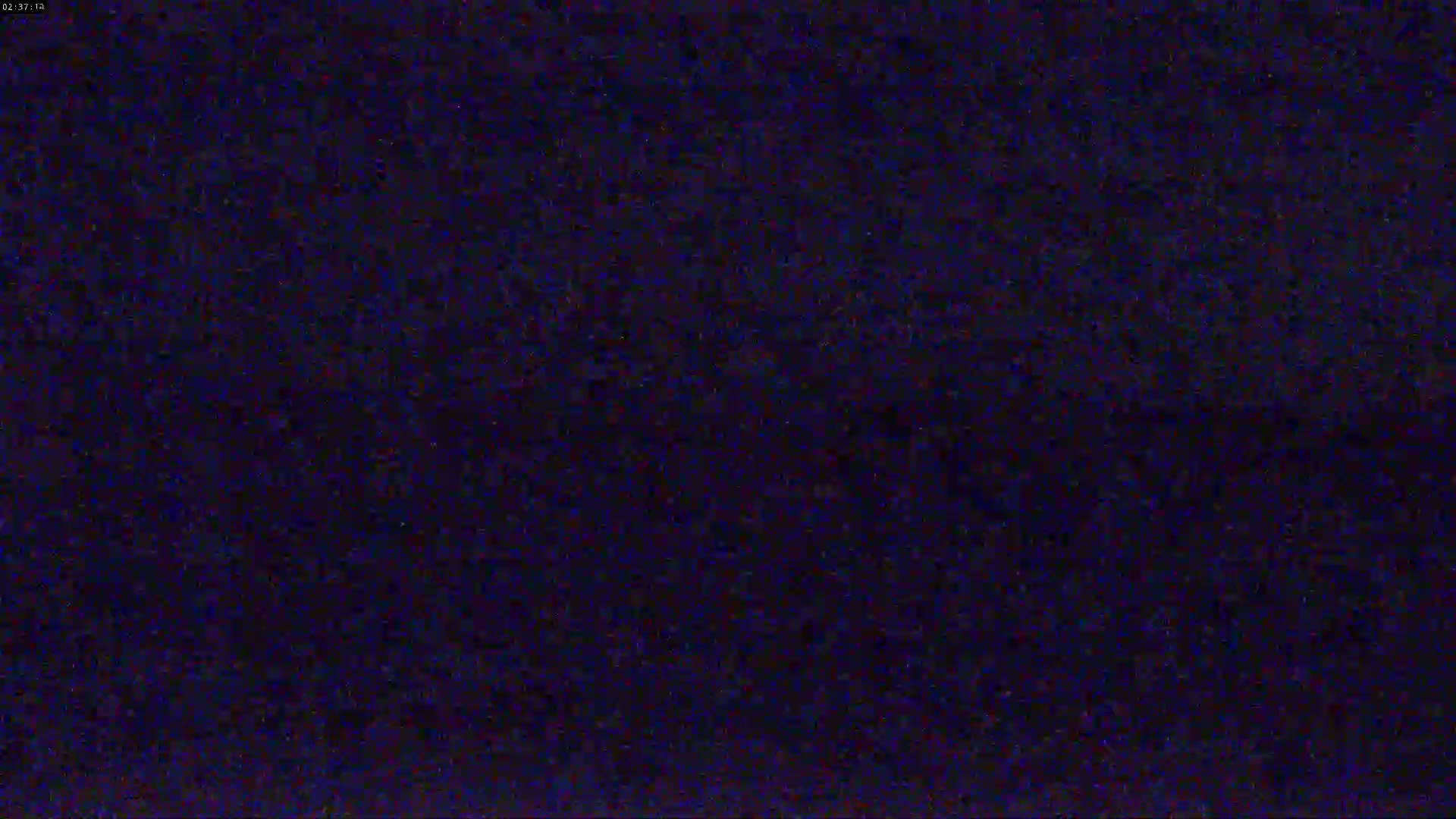 The image shows a dark blue screen filled with static.