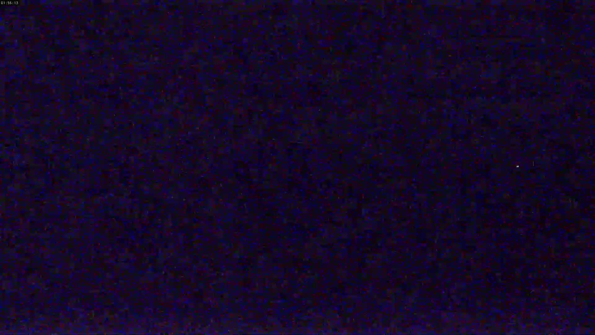 A dark, mostly uniform blue screen displays static.