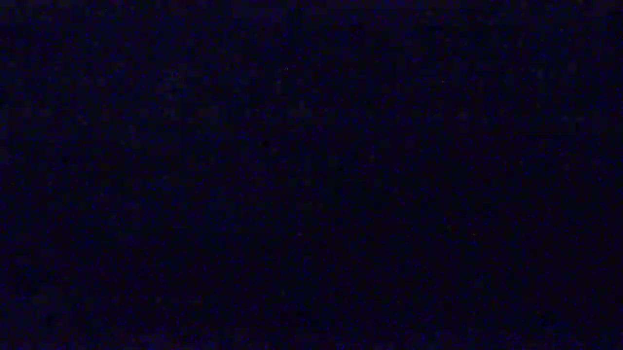 A dark blue screen filled with static.
