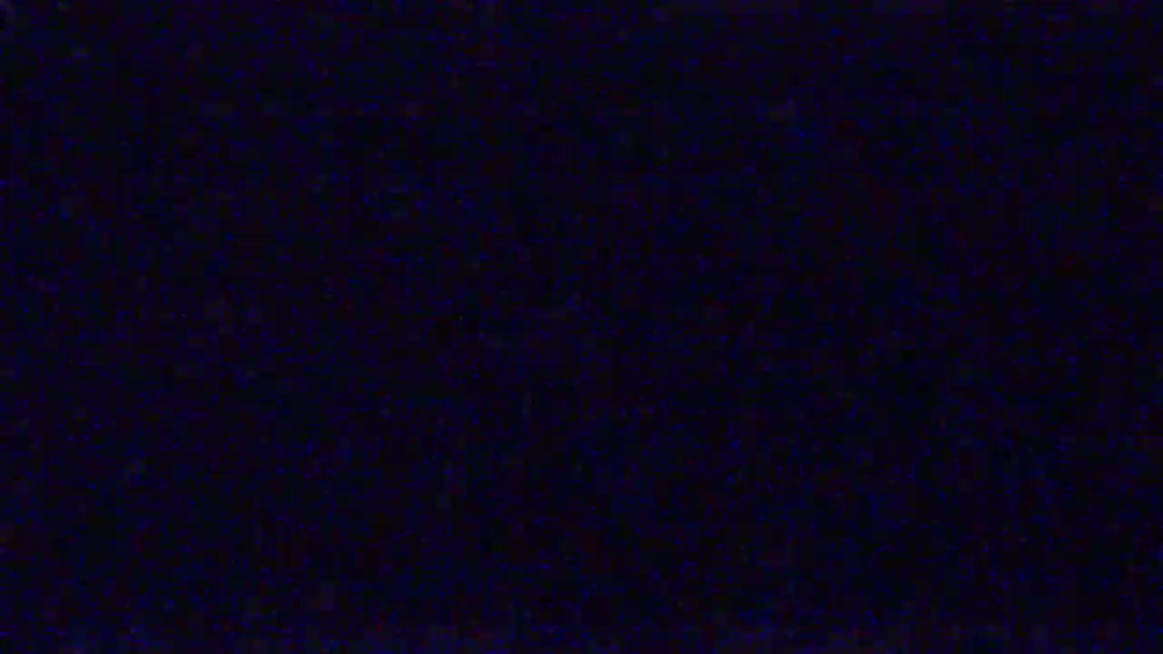 The image shows a dark blue screen filled with static.