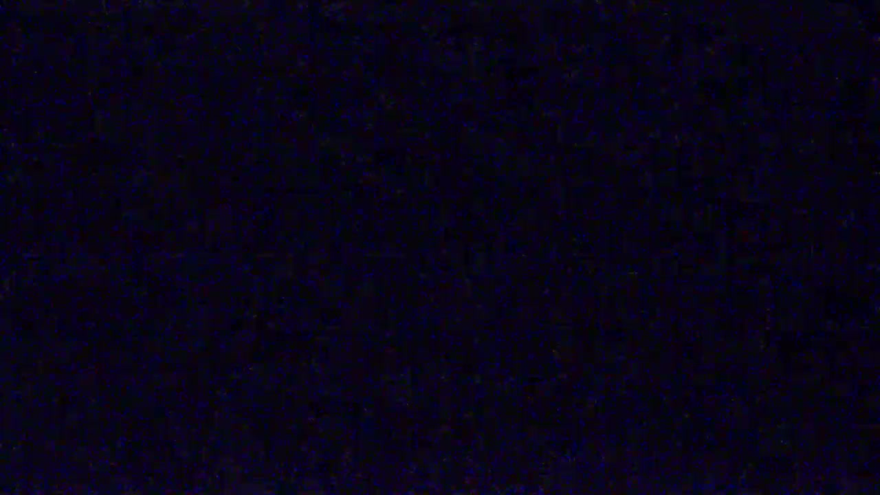 The image shows a dark blue screen filled with static.