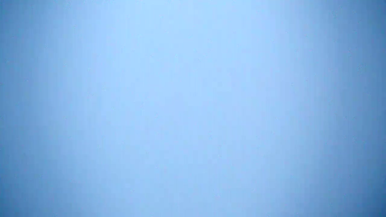 The image shows a light blue, solid-colored background.