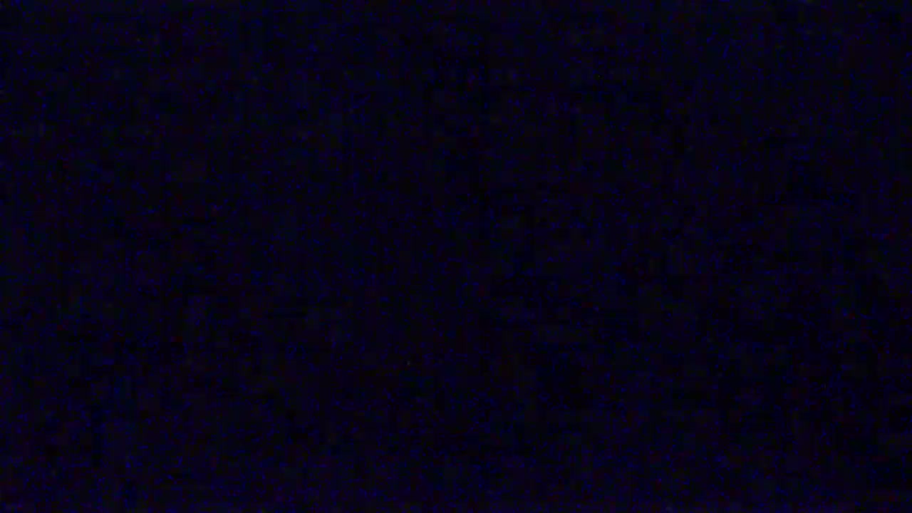 The image shows a dark blue screen filled with static.