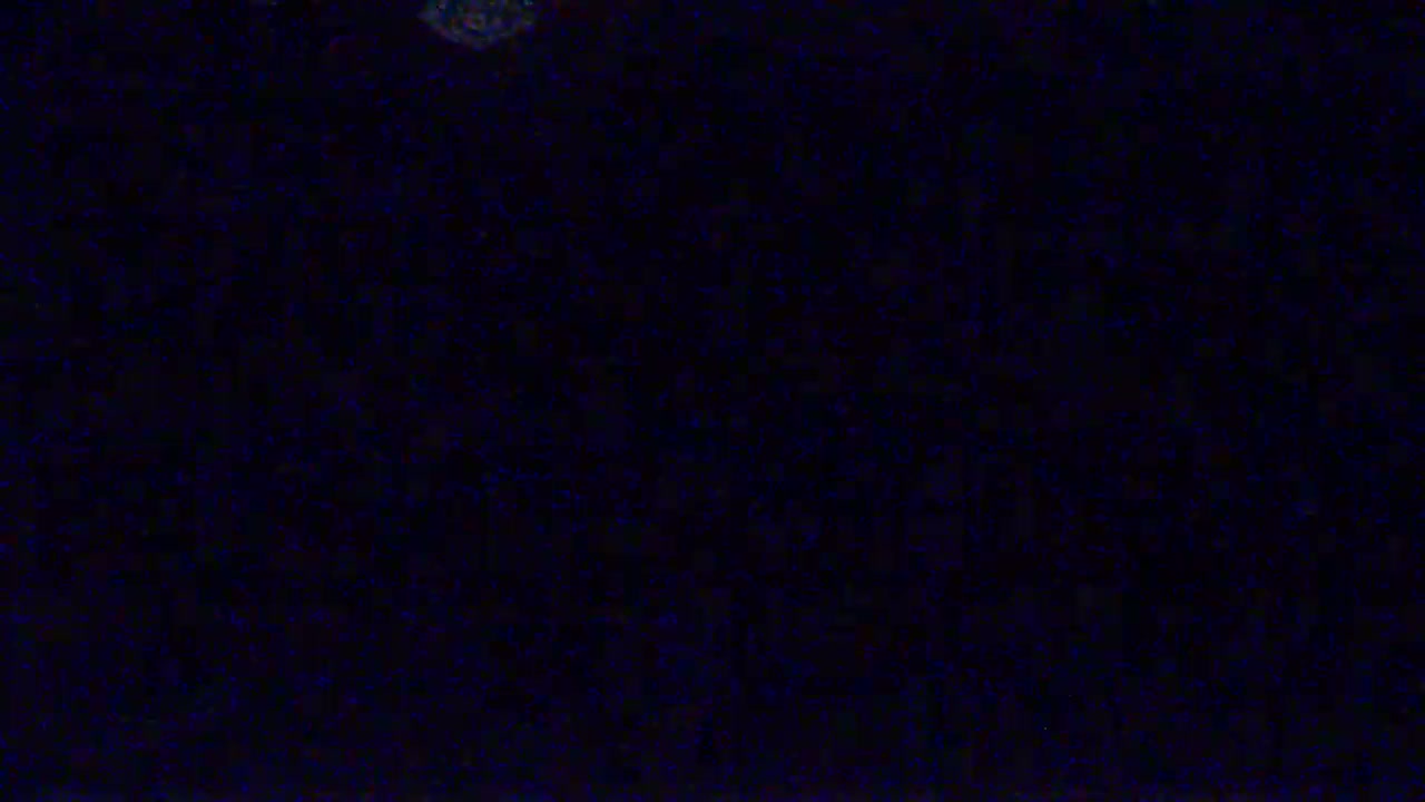 The image shows a dark blue screen filled with static noise.