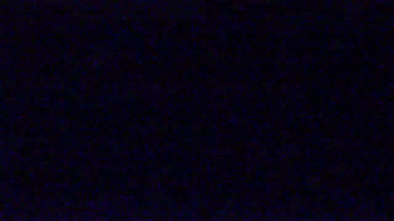 The image shows a dark blue screen filled with static.