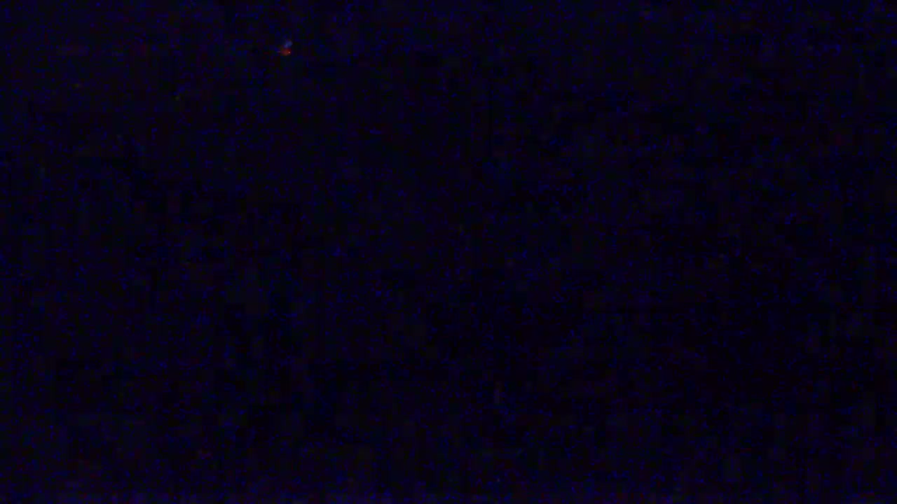 The image shows a dark blue screen filled with static.