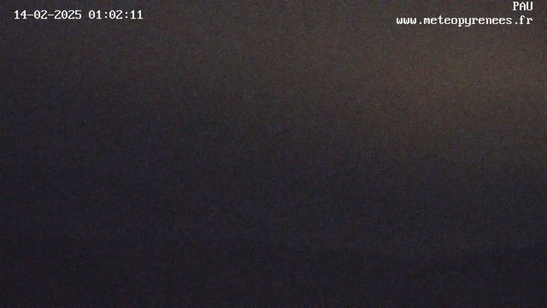 A dark, possibly nighttime, outdoor scene is shown with a uniformly dark gray-black appearance.