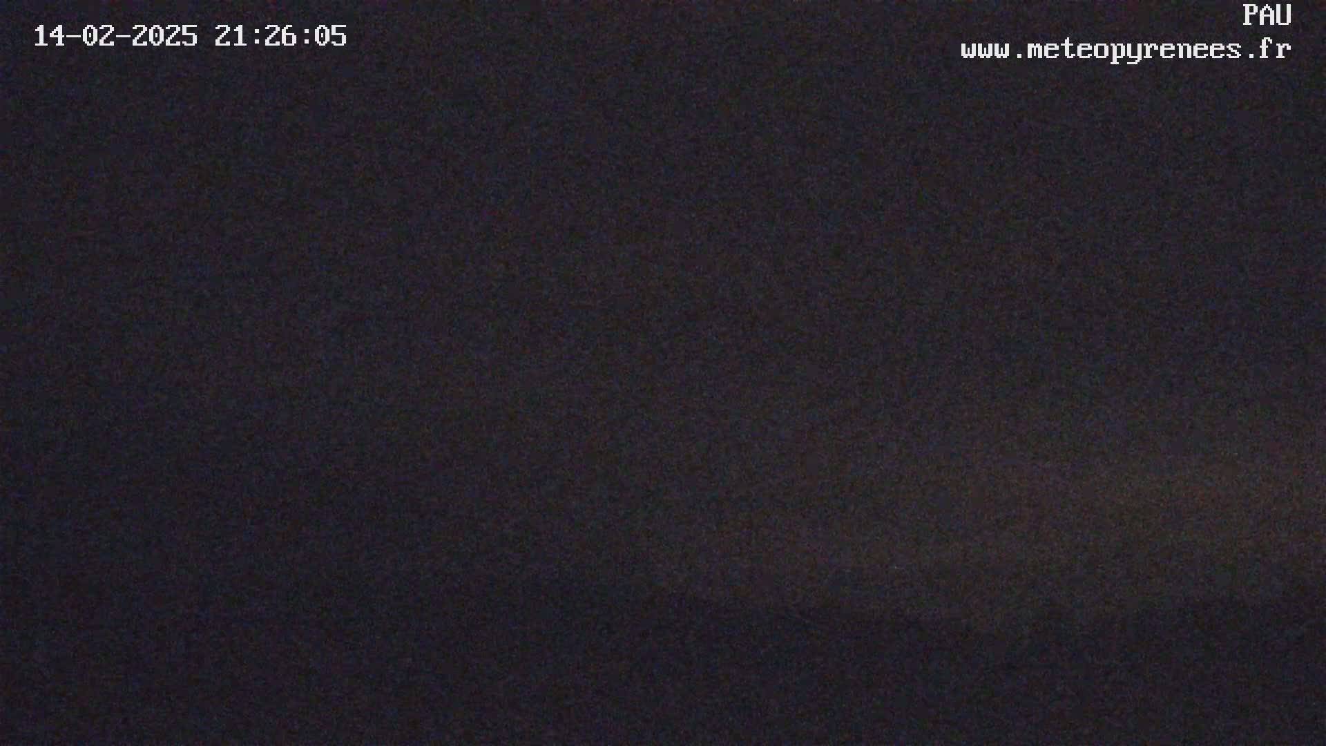 The image shows a dark, nighttime scene under a clear sky.