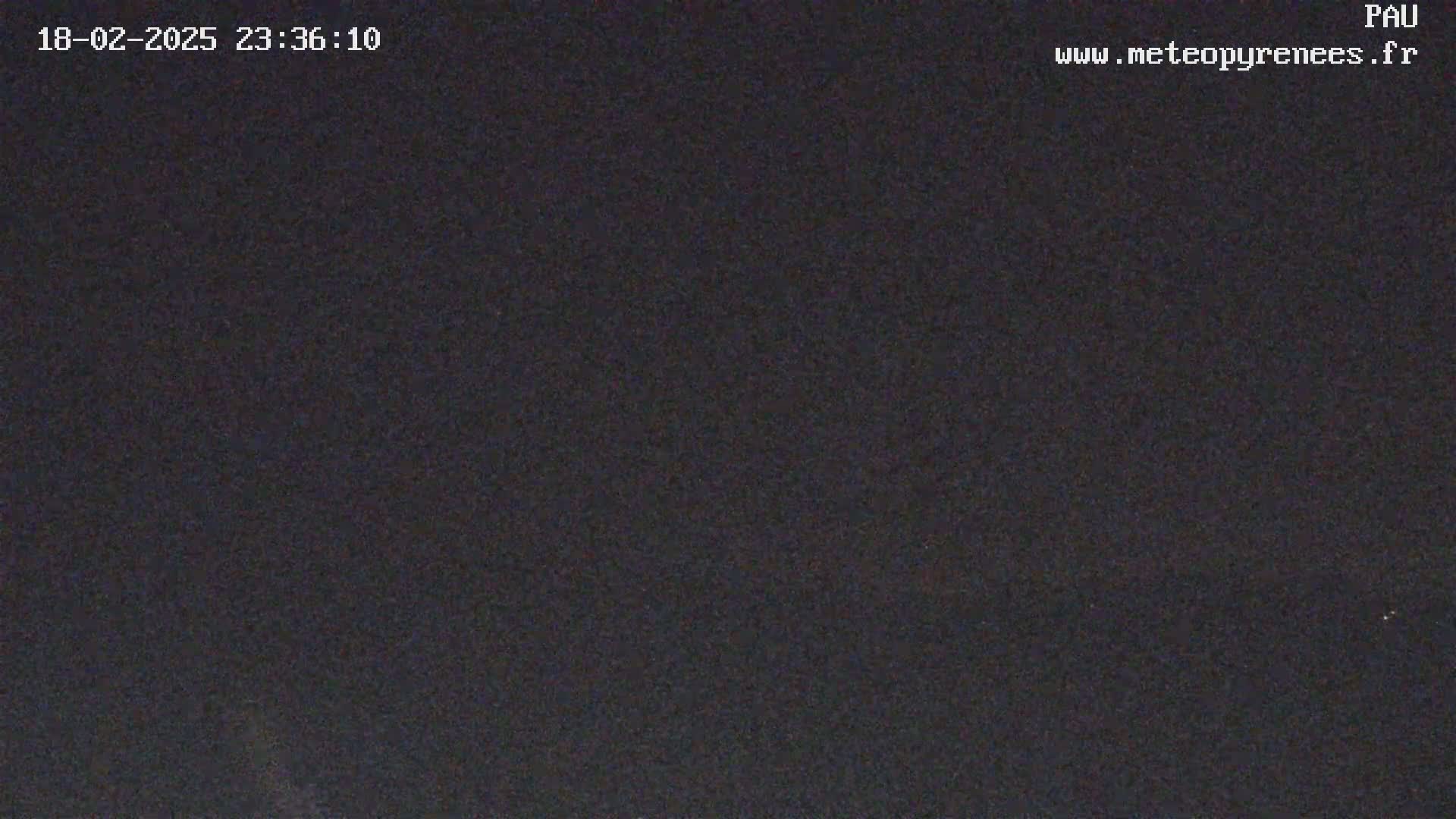 The image shows a completely dark, nighttime scene.