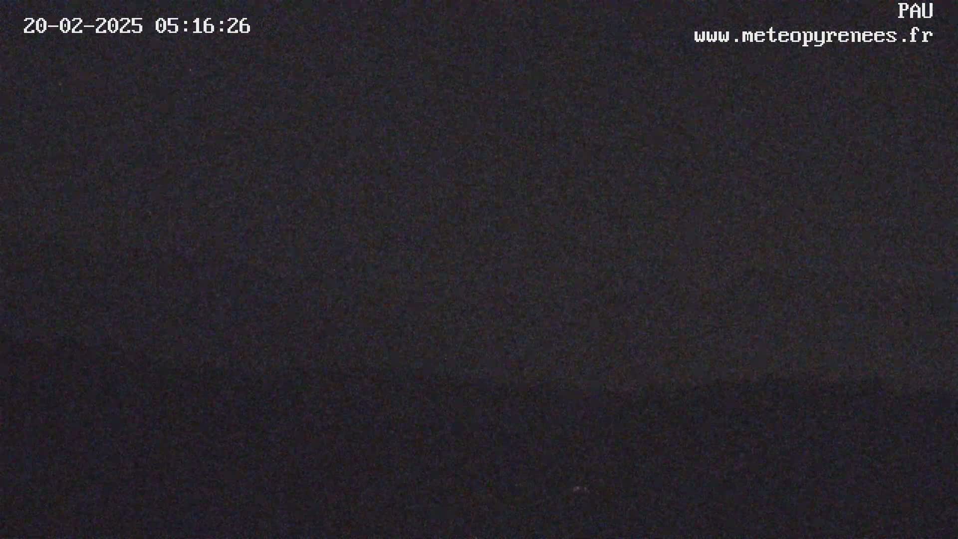 A dark, nighttime image shows a mostly uniform black field of view.
