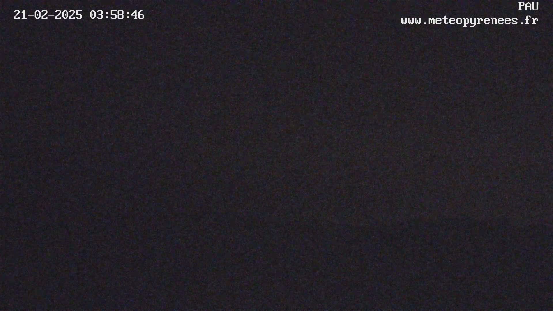 The image shows a completely dark, grainy view.