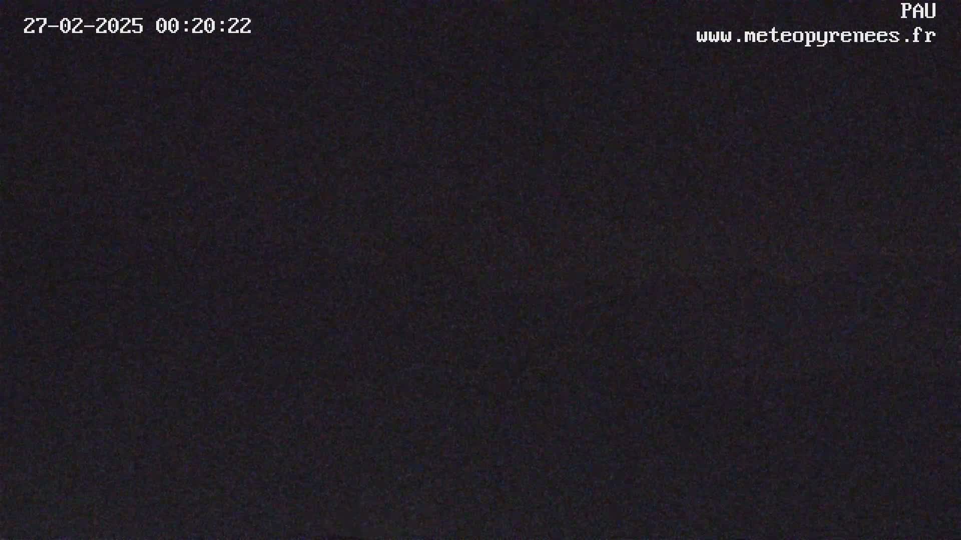 The image shows a completely dark, nighttime scene.