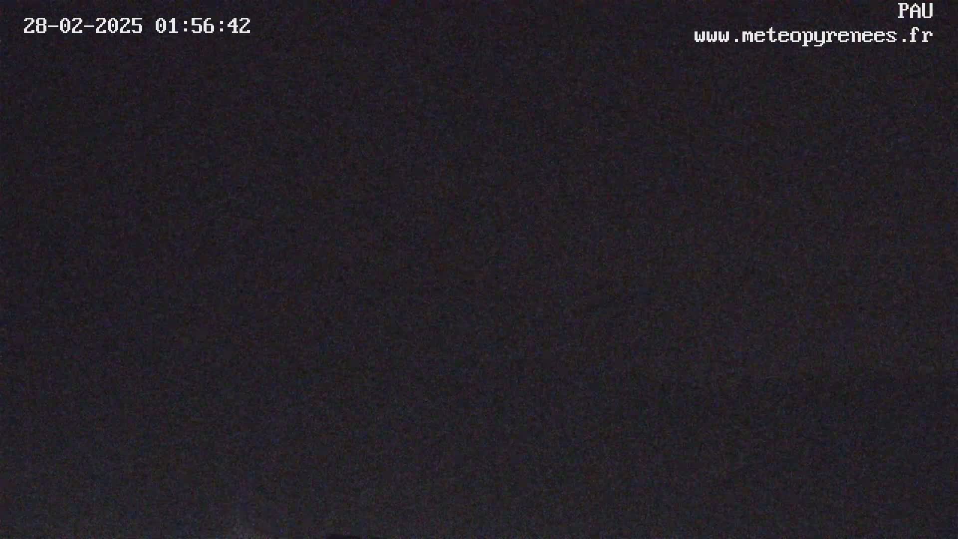 The image shows a completely dark, nighttime scene.