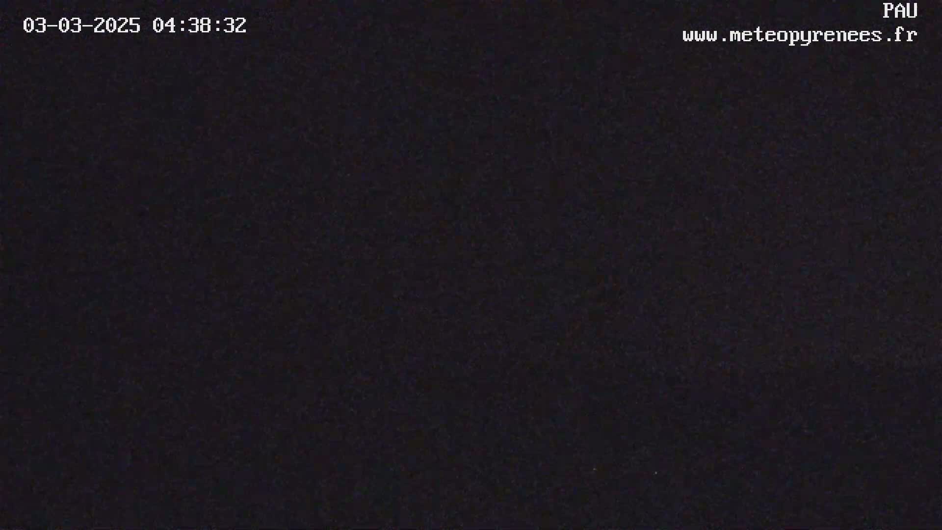 The image shows a completely dark scene at night.