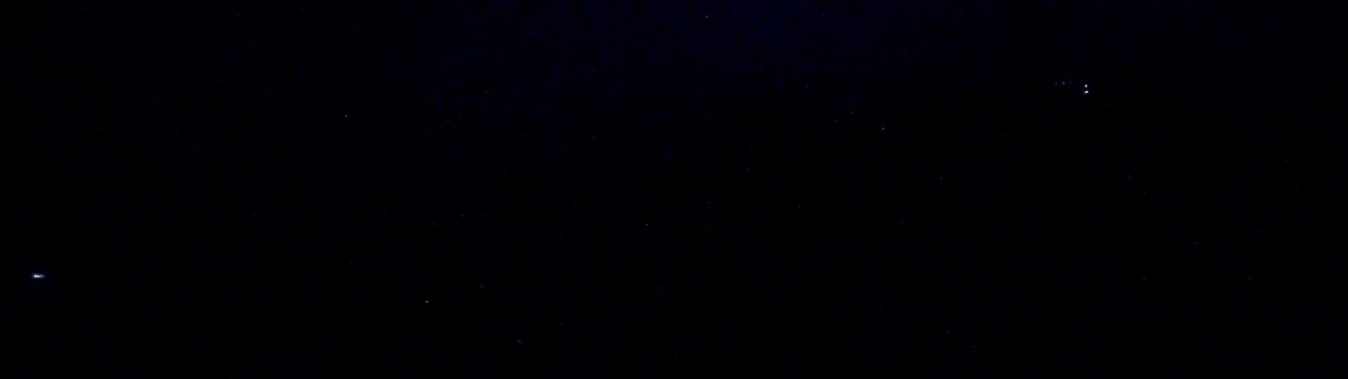 A dark night sky speckled with numerous faint stars is visible.