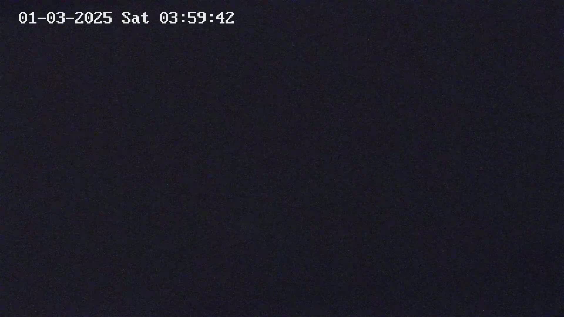 A dark, grainy image shows a completely black field of view.