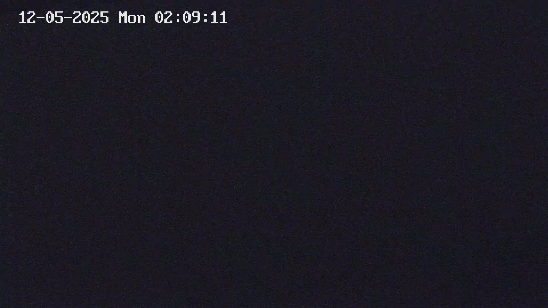 The image is a completely dark, solid black screen.