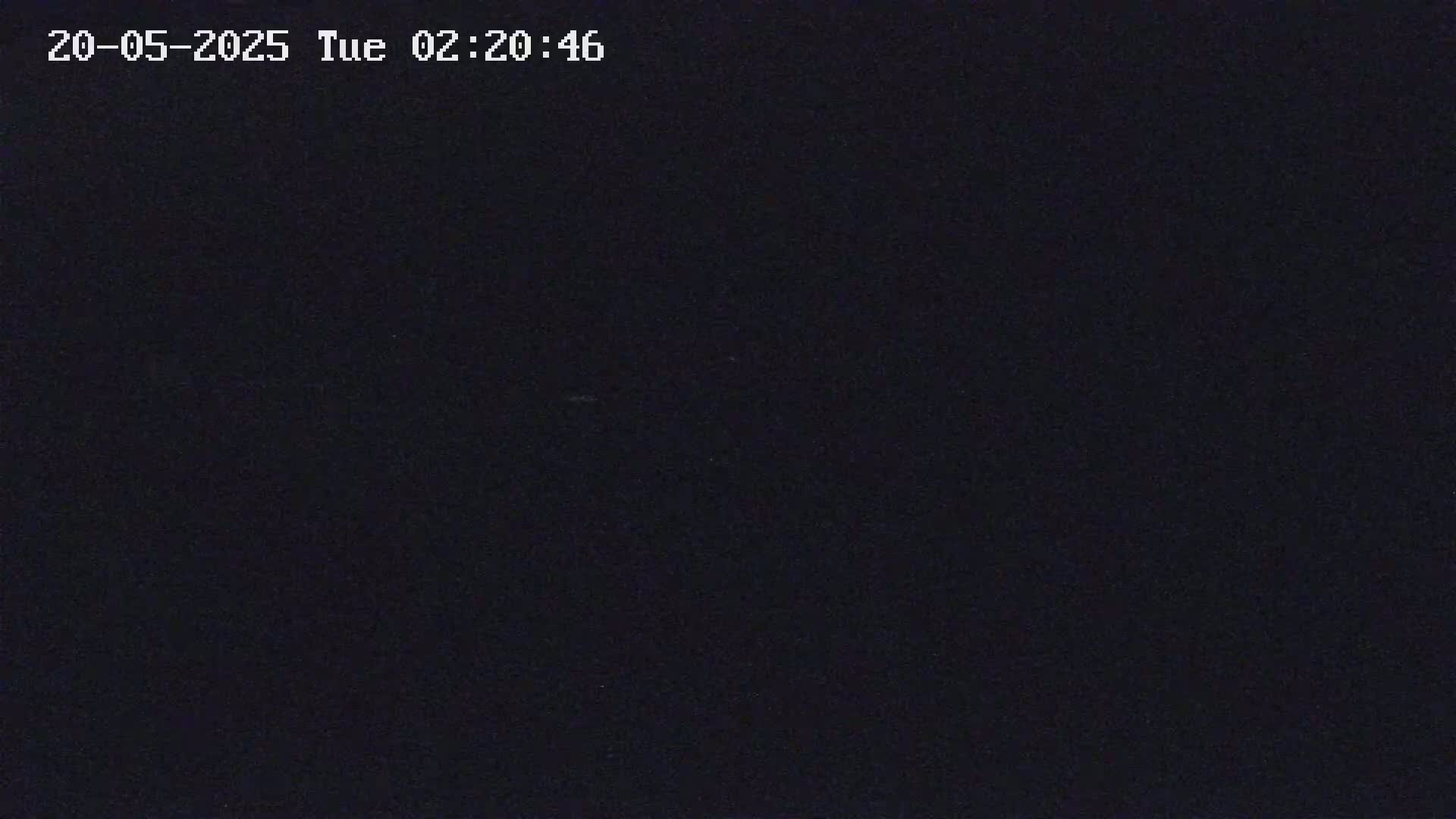 The image is a completely dark, possibly nighttime, scene.