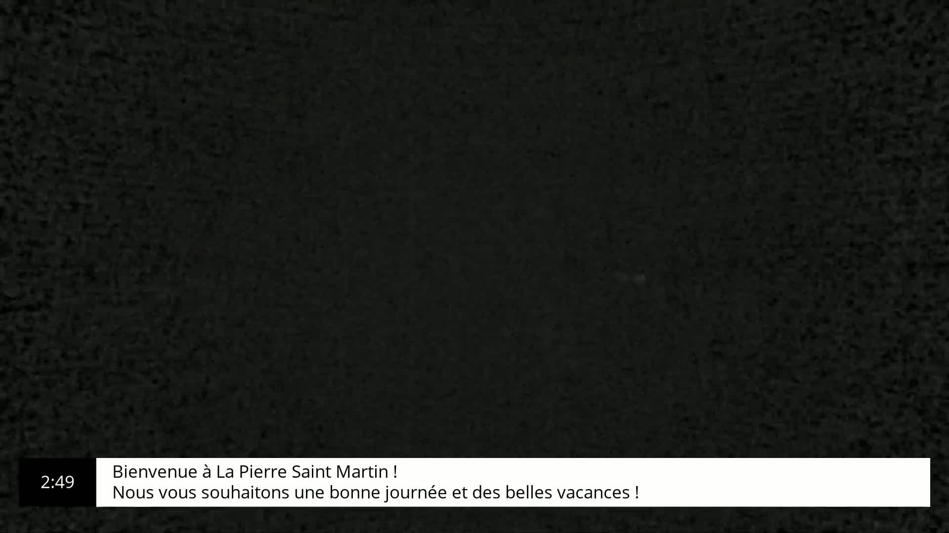 A dark, grainy image fills the screen.
