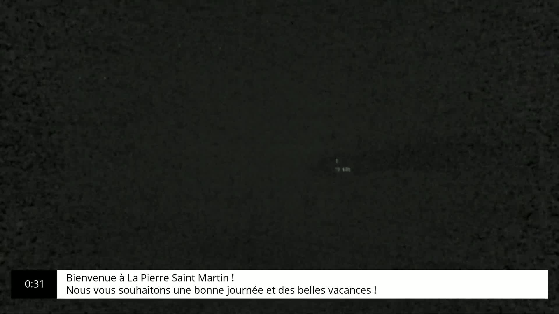 A dark, grainy image fills the screen.