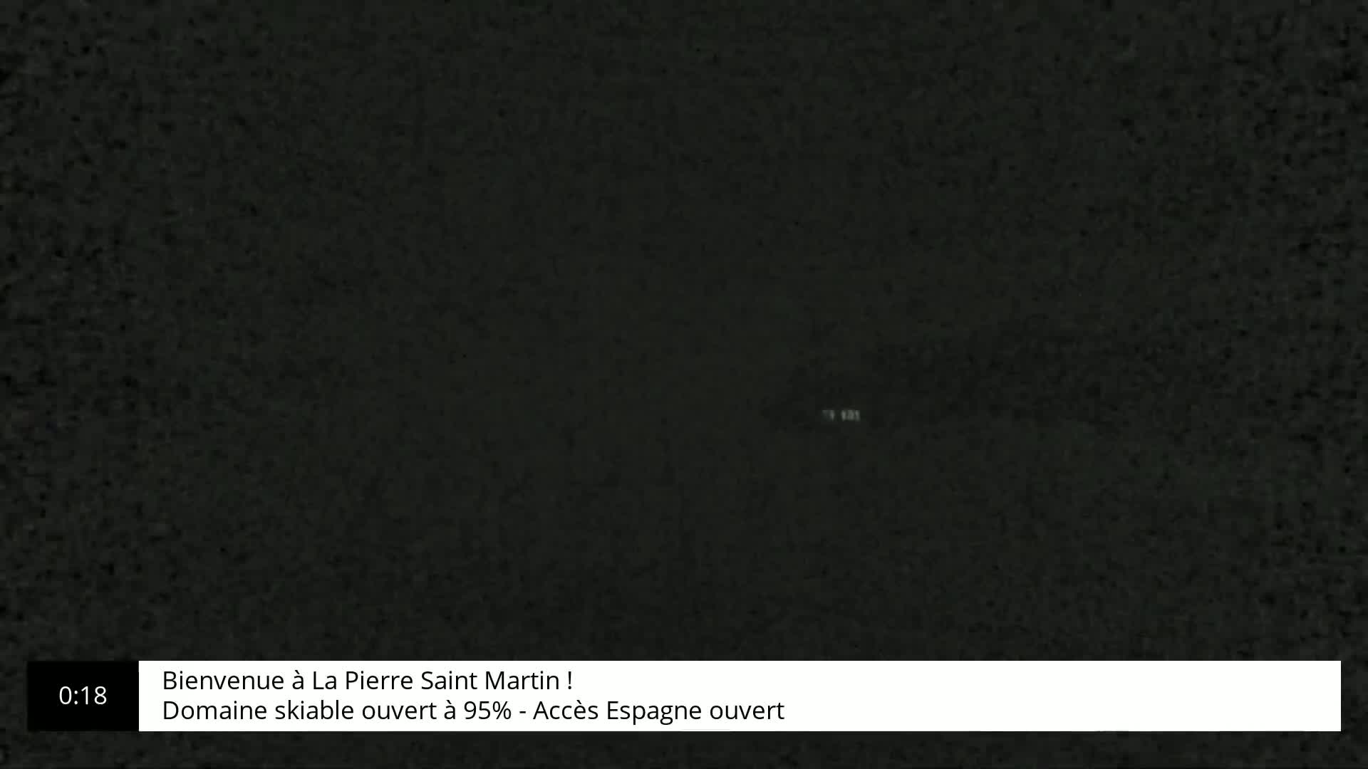 A dark, grainy image shows a solid black screen.