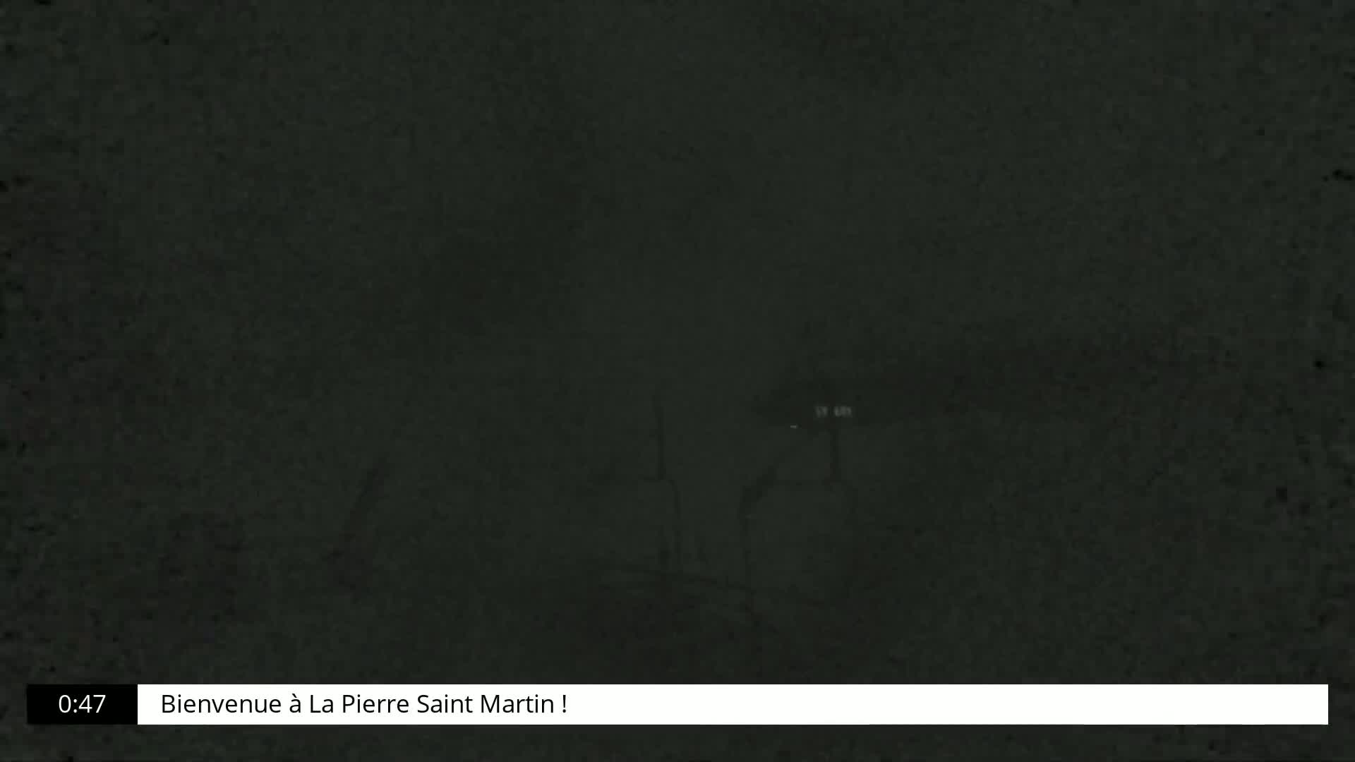 A dark, blurry image shows indistinct shapes in the night.