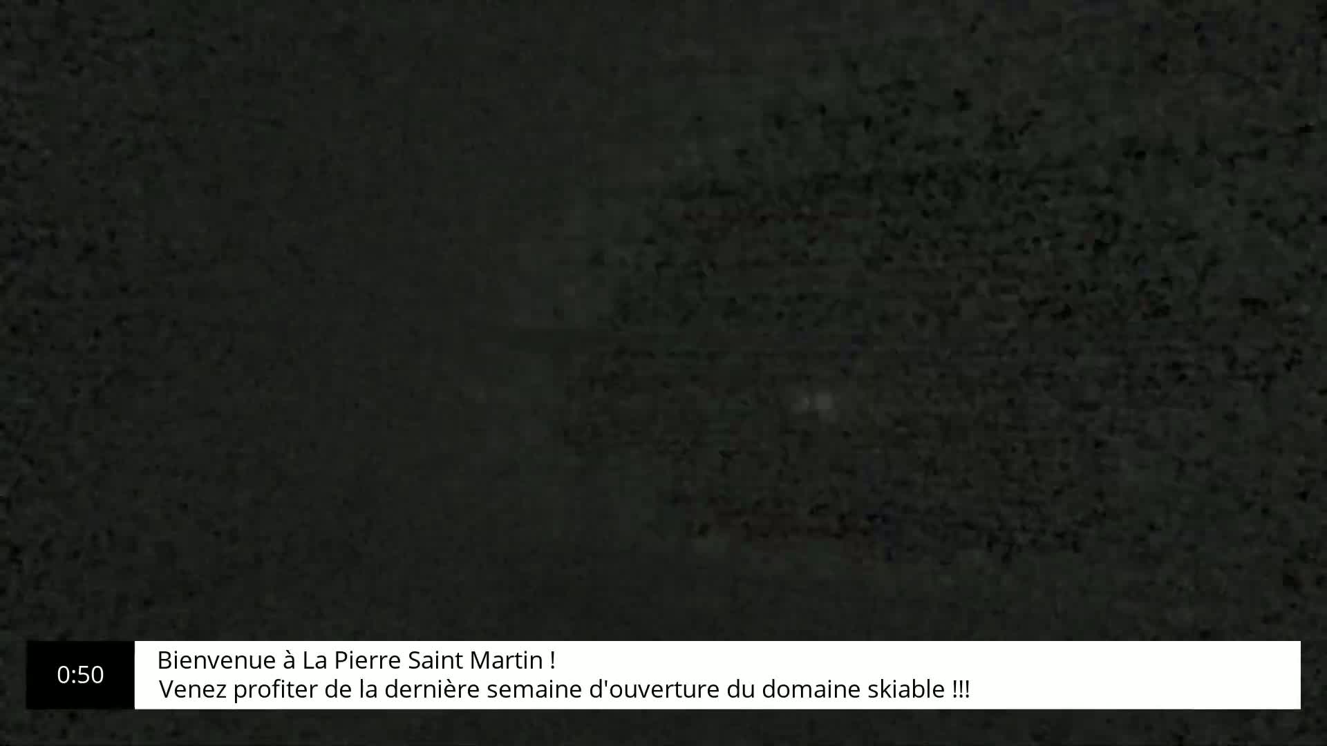 A grainy, dark gray image fills the screen.