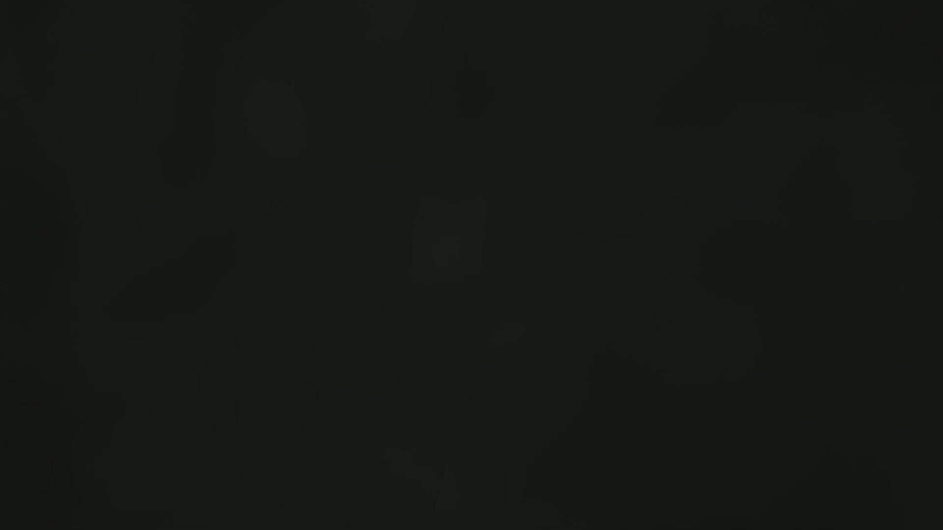 The image is a completely dark, blurry black.