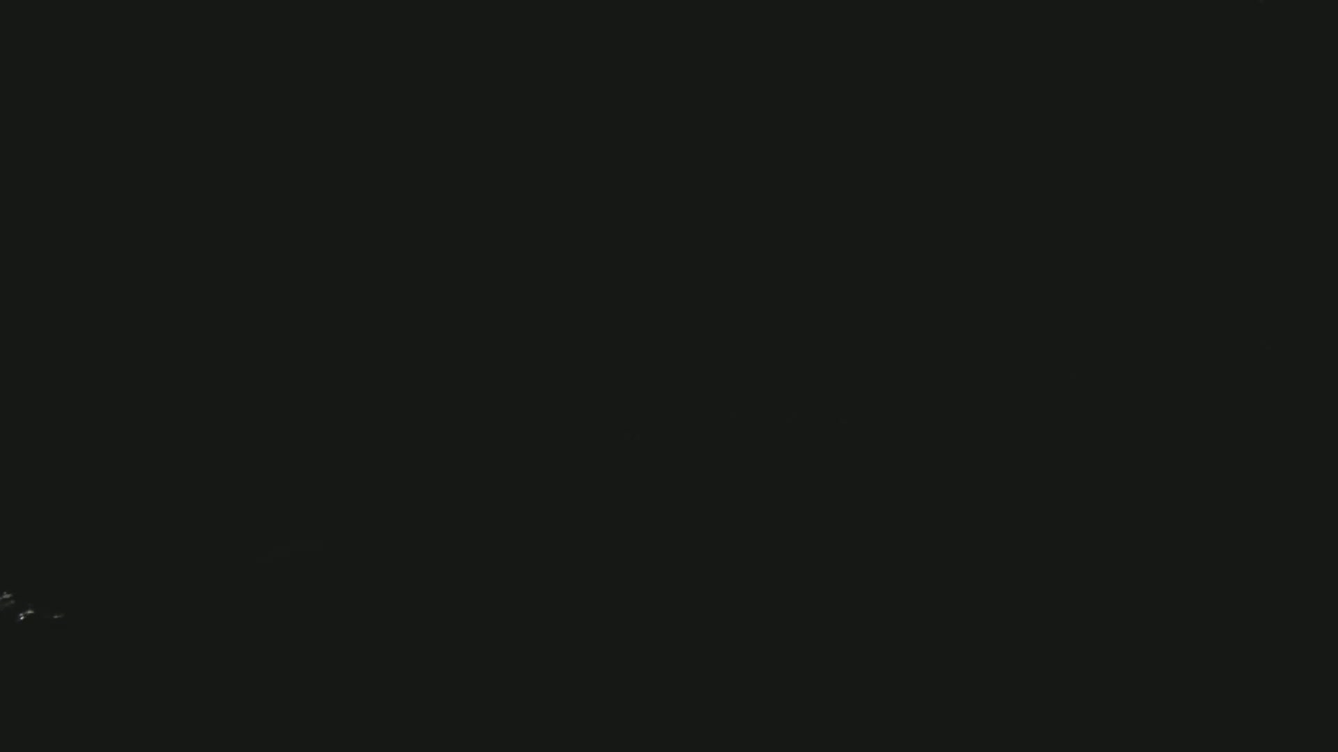 The image is almost entirely black, with a few faint, barely visible specks of light in the bottom left corner.
