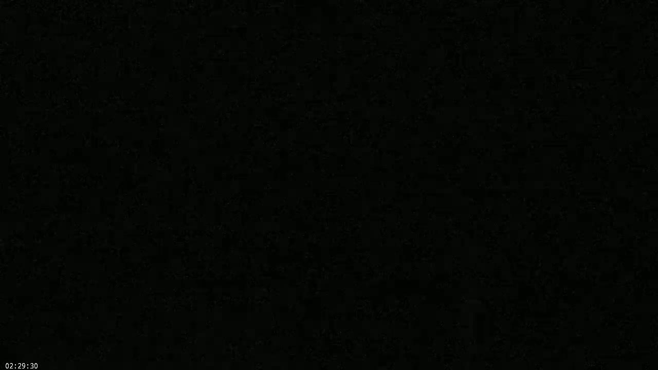 The image is a completely black screen with slight variations in shading.
