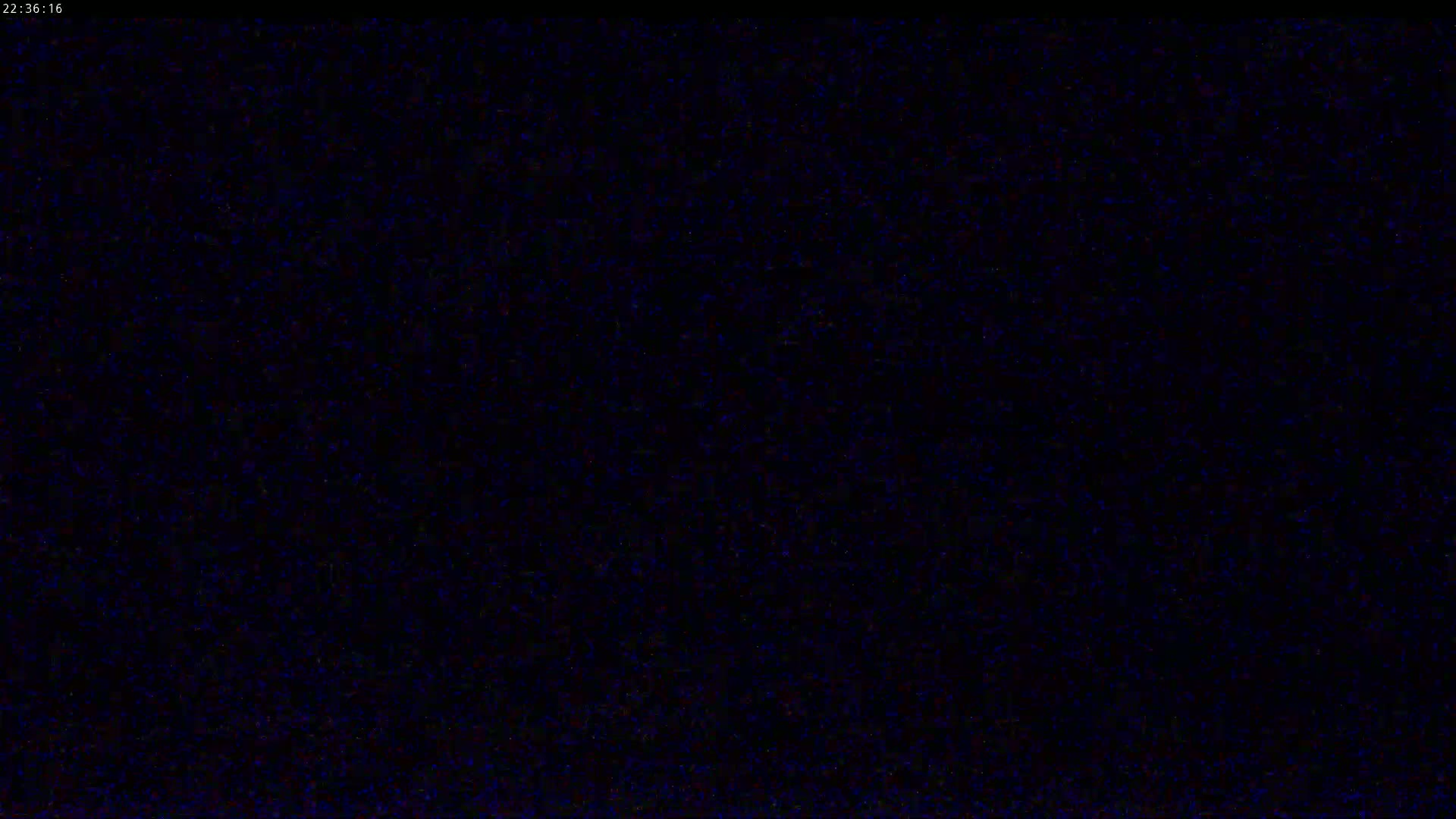 The image shows a completely dark screen with a slightly grainy texture.