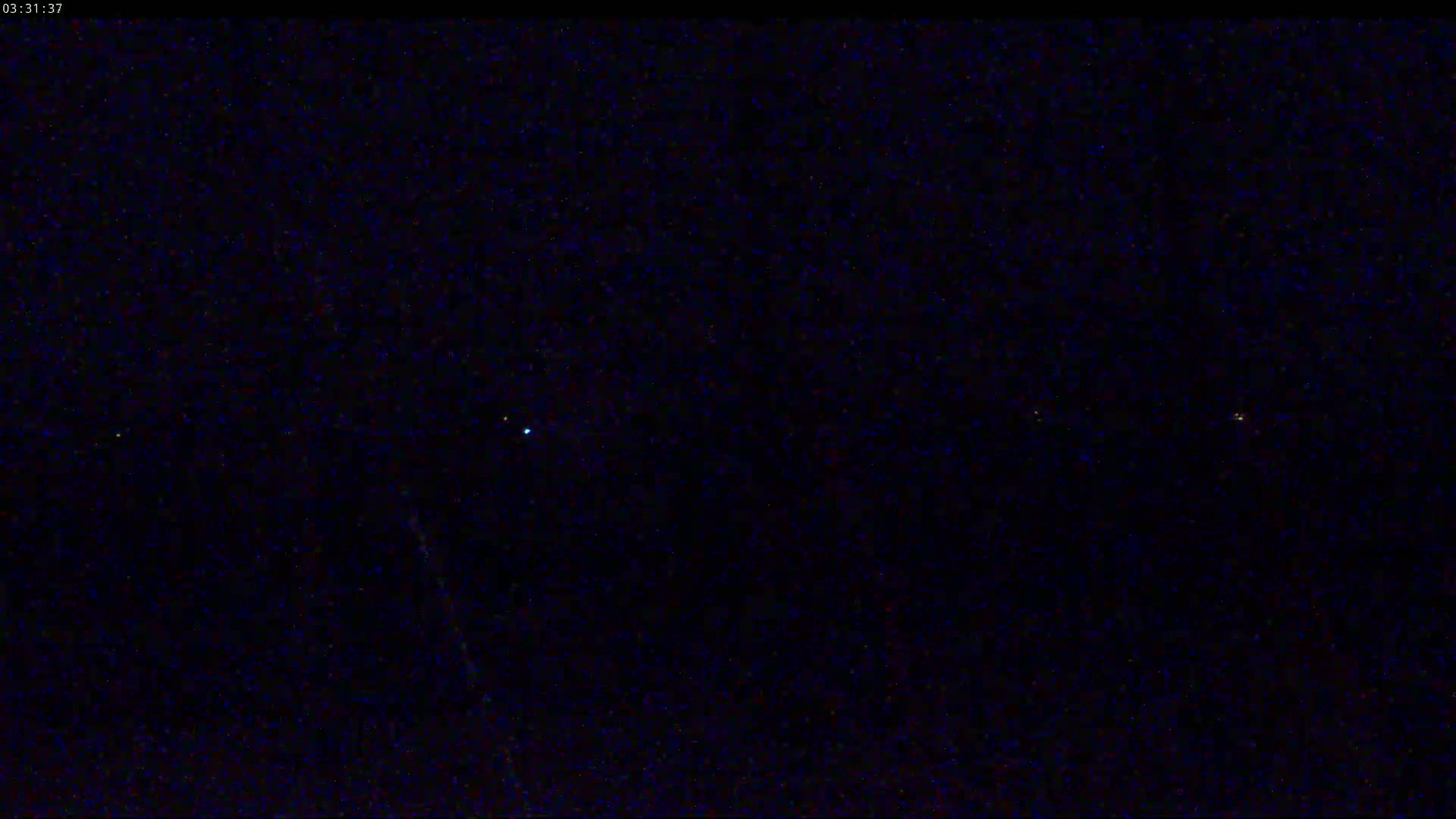 A nighttime image shows a dark sky speckled with numerous faint stars.