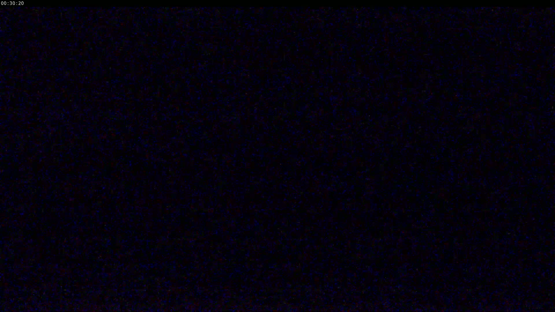 The image shows a completely black screen with a slight grainy texture.