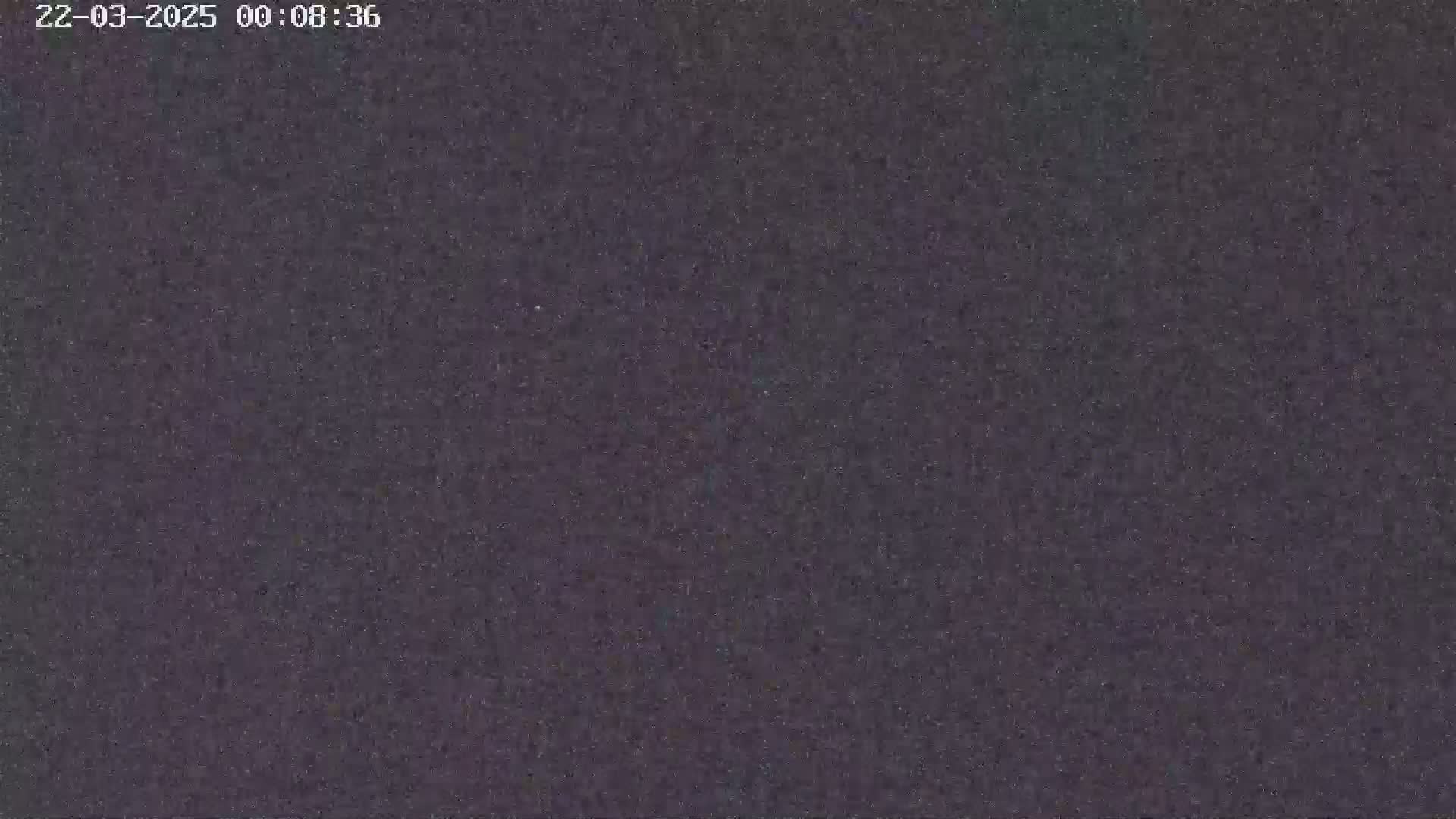 The image shows a dark gray, textured surface.