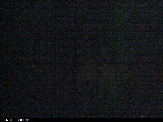 The image shows a completely dark scene, possibly at night.