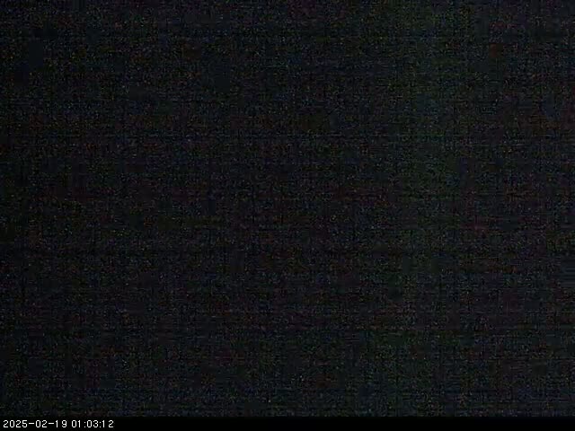 The image shows a completely dark, grainy screen.