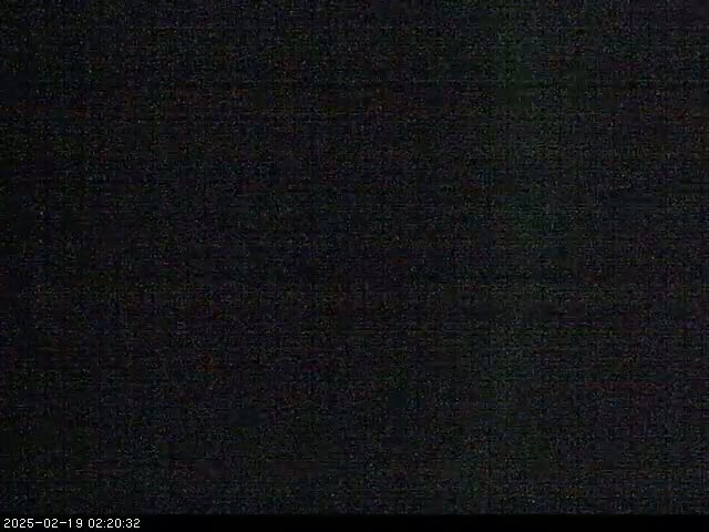 The image shows a completely dark, grainy field of view.