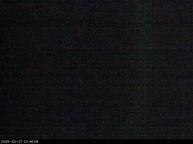 The image shows a completely dark screen with subtle noise.