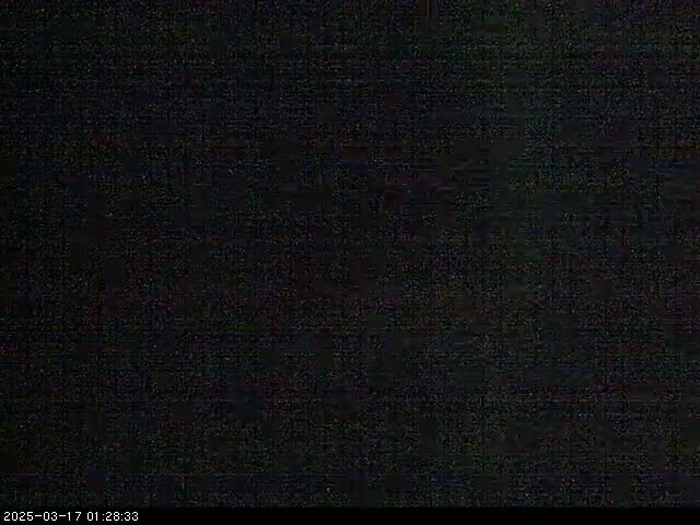 The image is entirely dark, with a slightly grainy texture.
