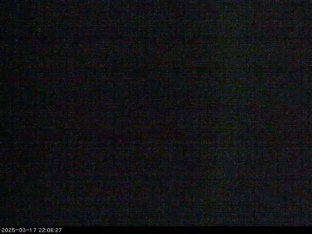 The image shows a completely dark, grainy screen.