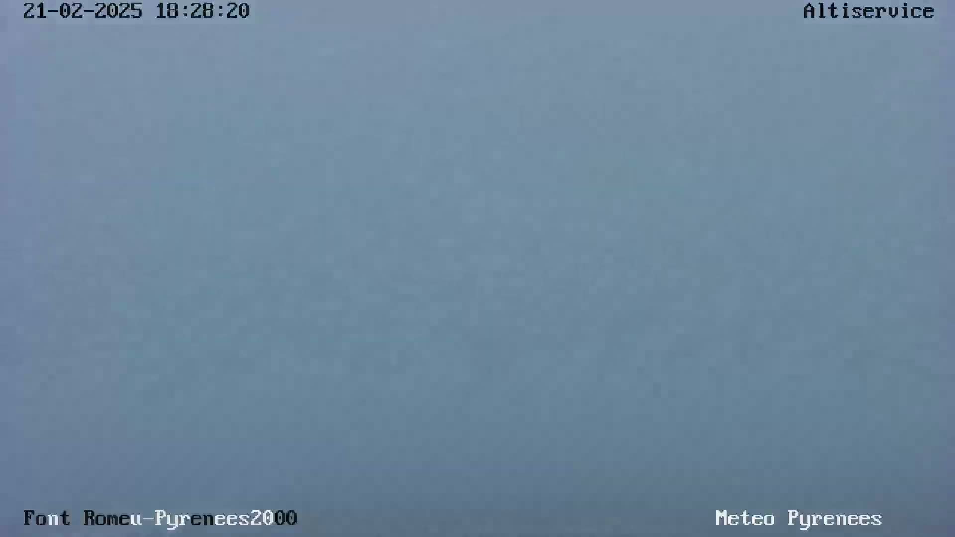 A solid, light-blue screen is shown, possibly indicating an overcast sky.