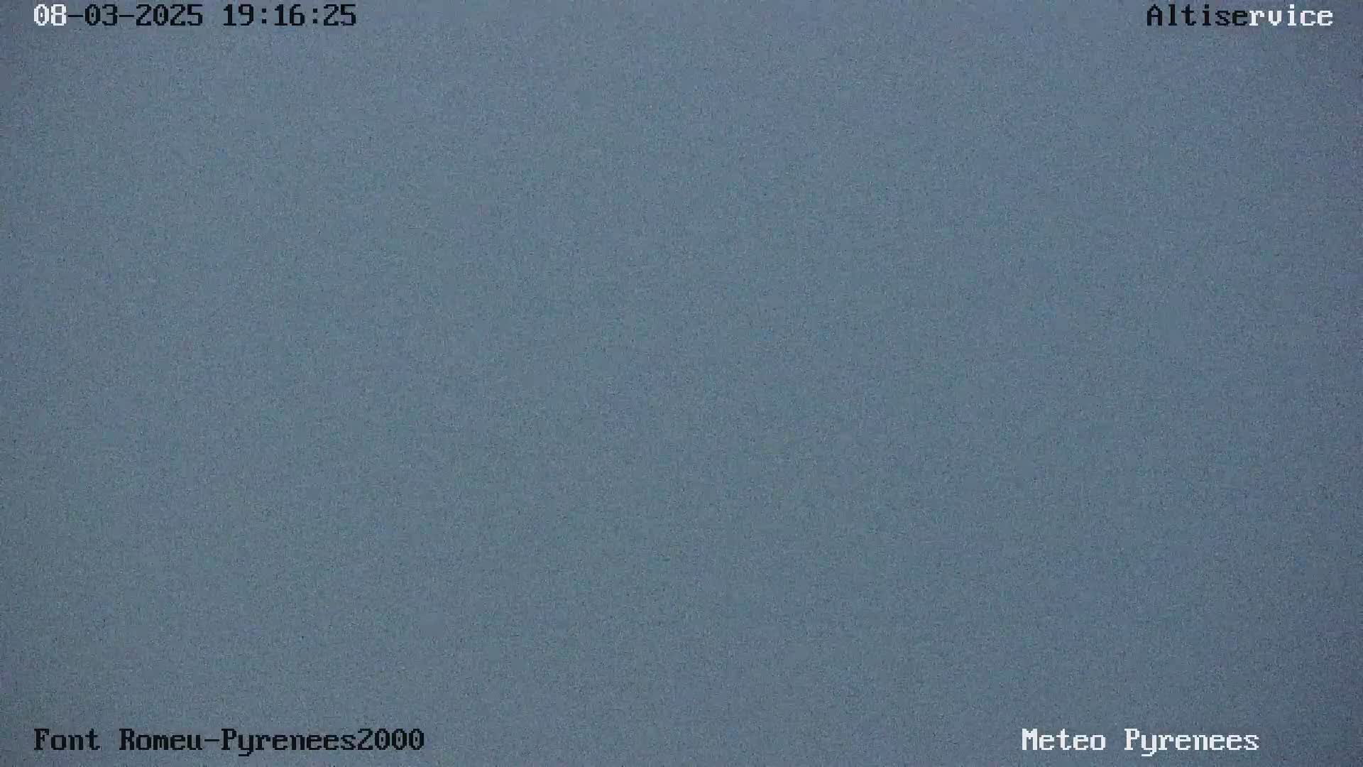 A solid, slate-blue image shows an overcast sky.