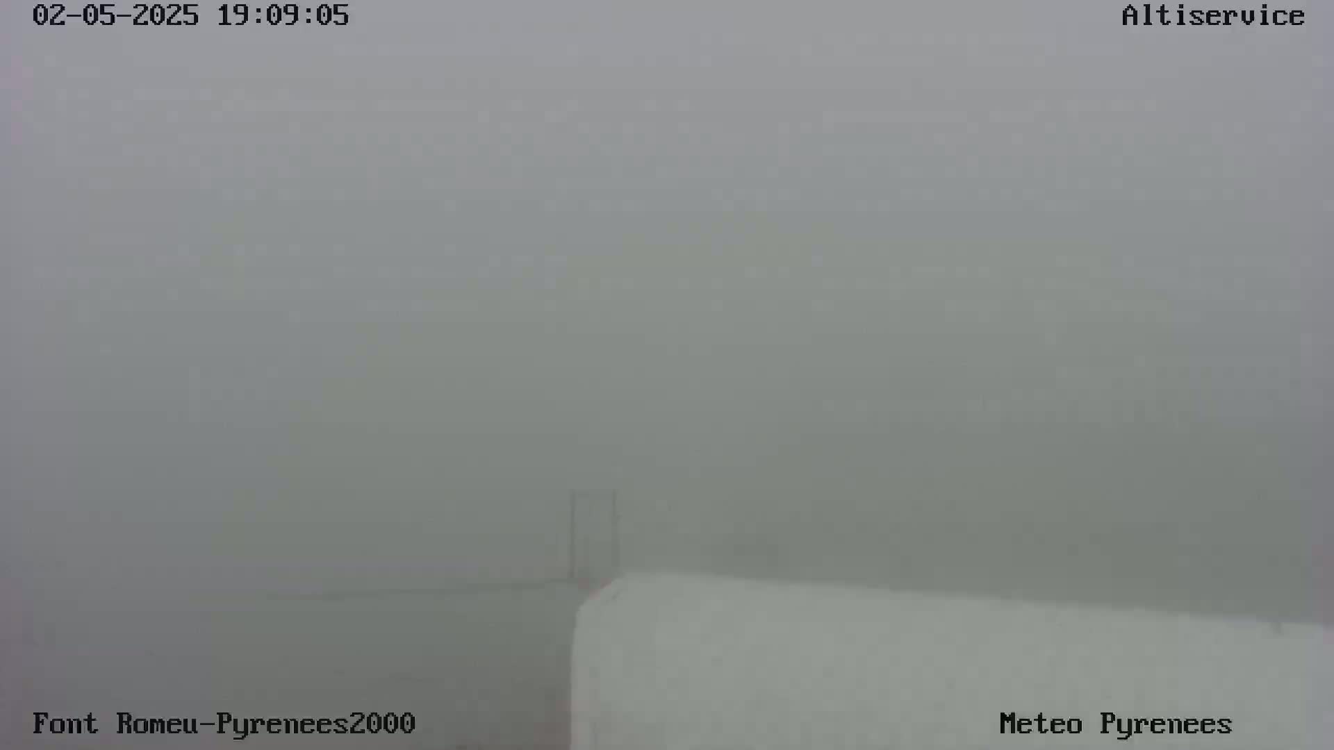 A mostly obscured view of a white surface under foggy conditions.