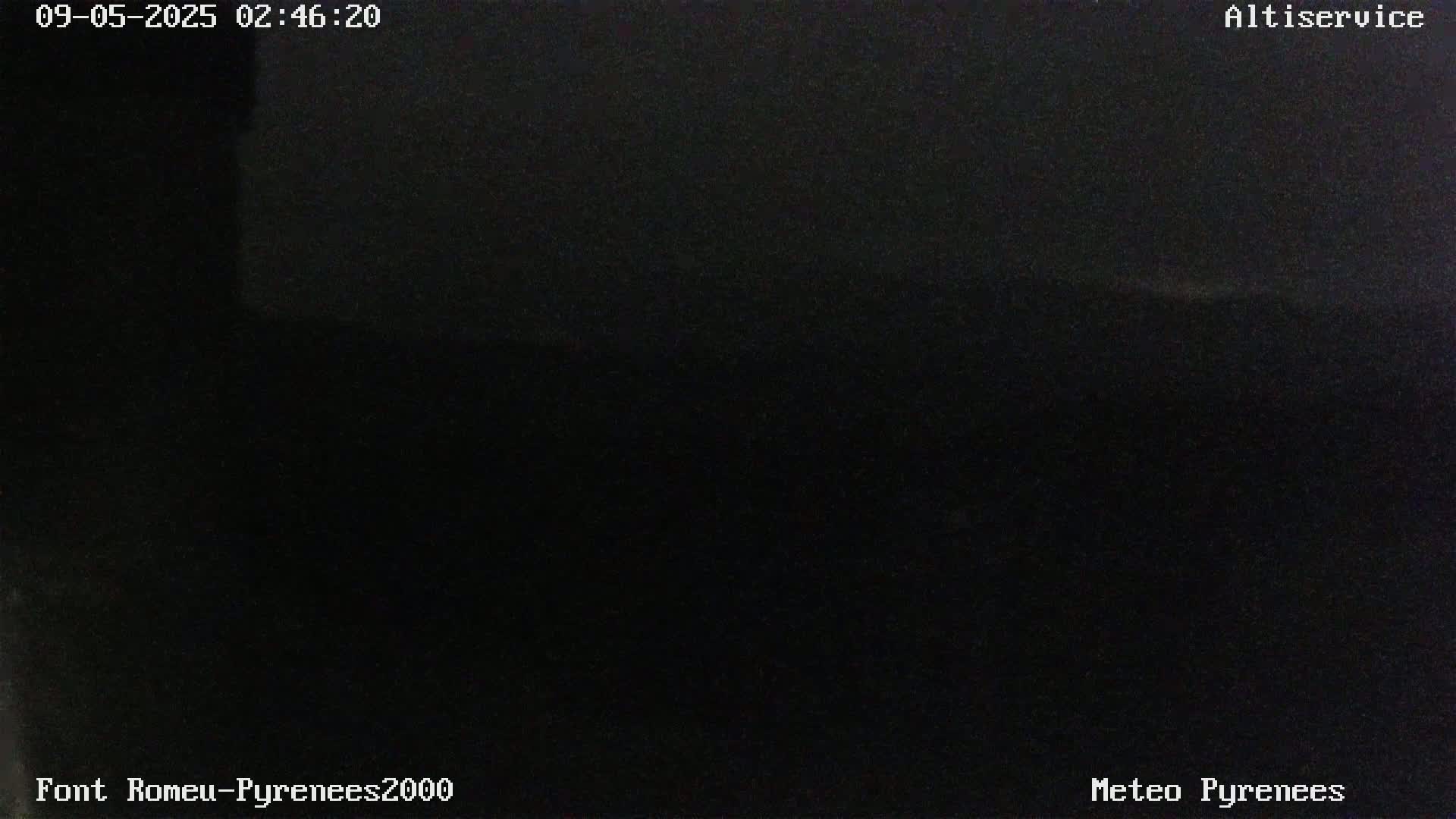 The image shows a completely dark scene at night.
