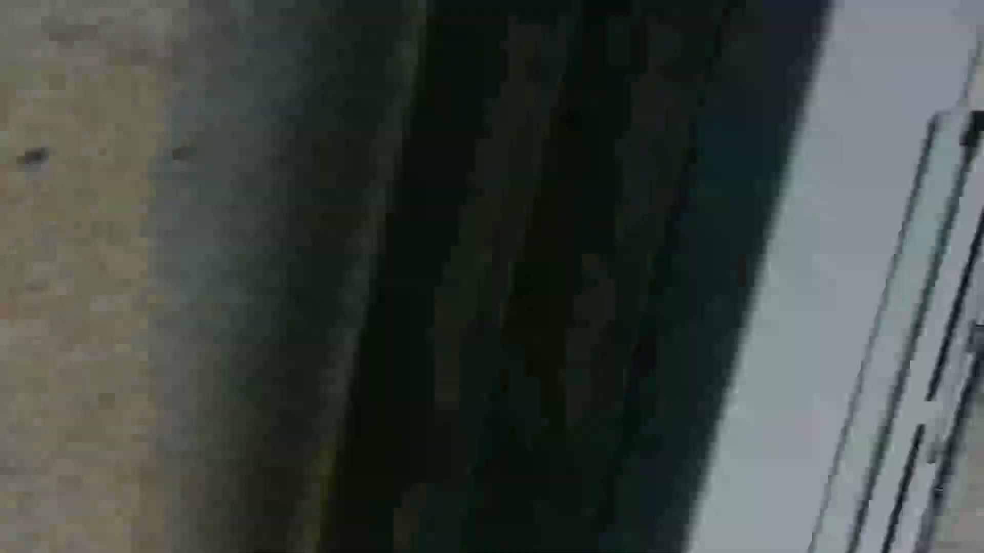 A blurry, low-resolution image shows a section of a tan-colored surface next to a dark-colored vertical surface and a light-colored vertical surface with horizontal lines.