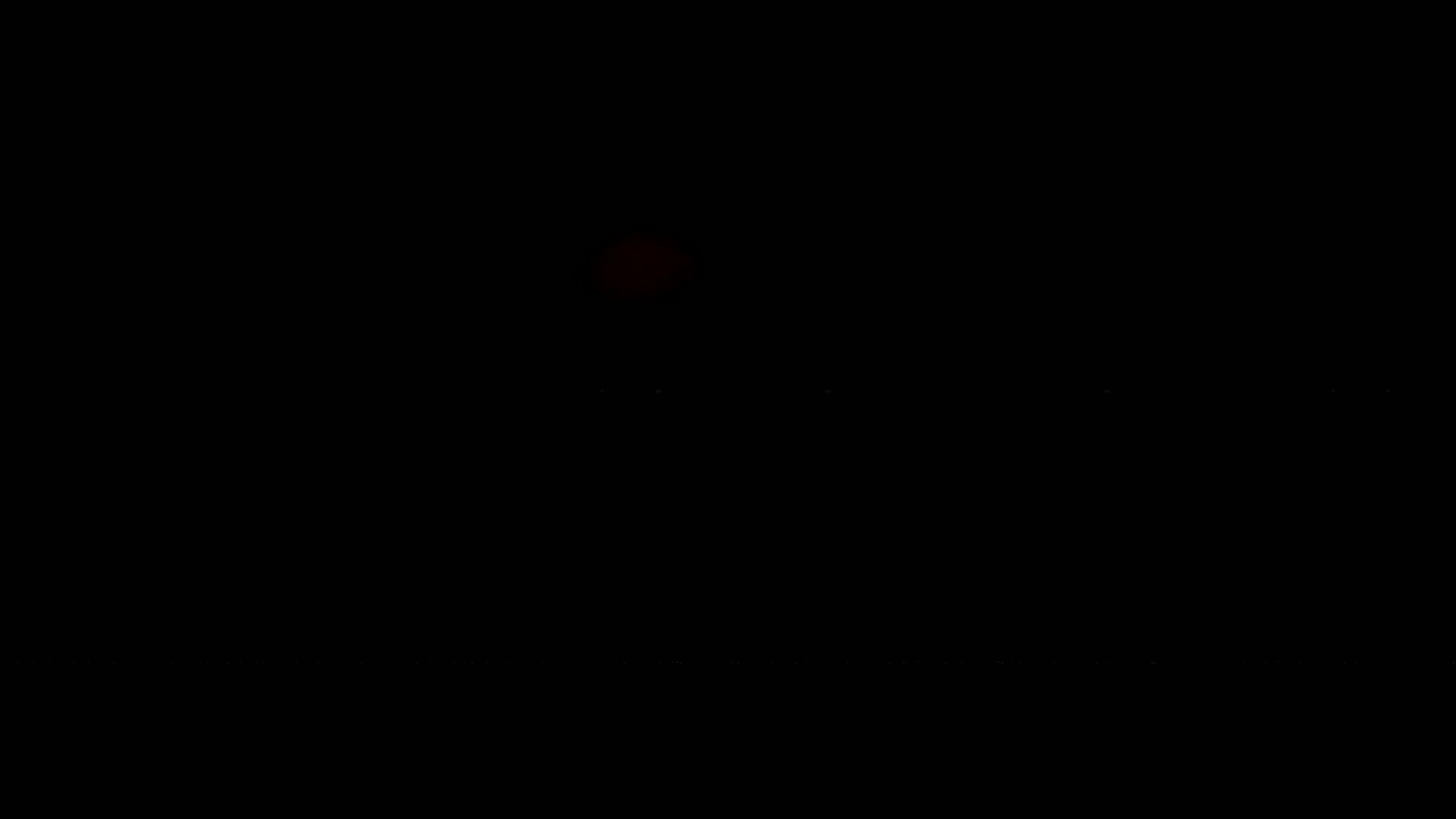 A blurry, dark image shows a reddish glow near the top center.